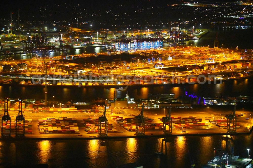 Hamburg at night from above - Night lighting container Terminal Tollerort in the port of the international port in district Steinwerder in Hamburg with sewage works Koehlbrandhoeft