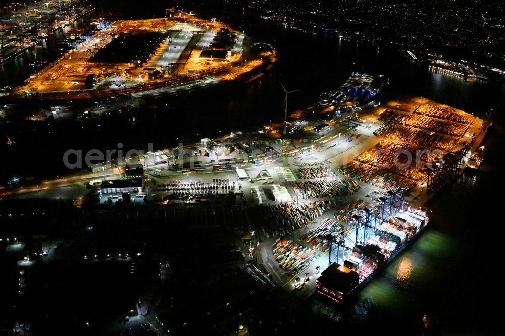 Hamburg at night from the bird perspective: Night lighting container Terminal Tollerort in the port of the international port in district Steinwerder in the district Steinwerder in Hamburg with sewage works Koehlbrandhoeft