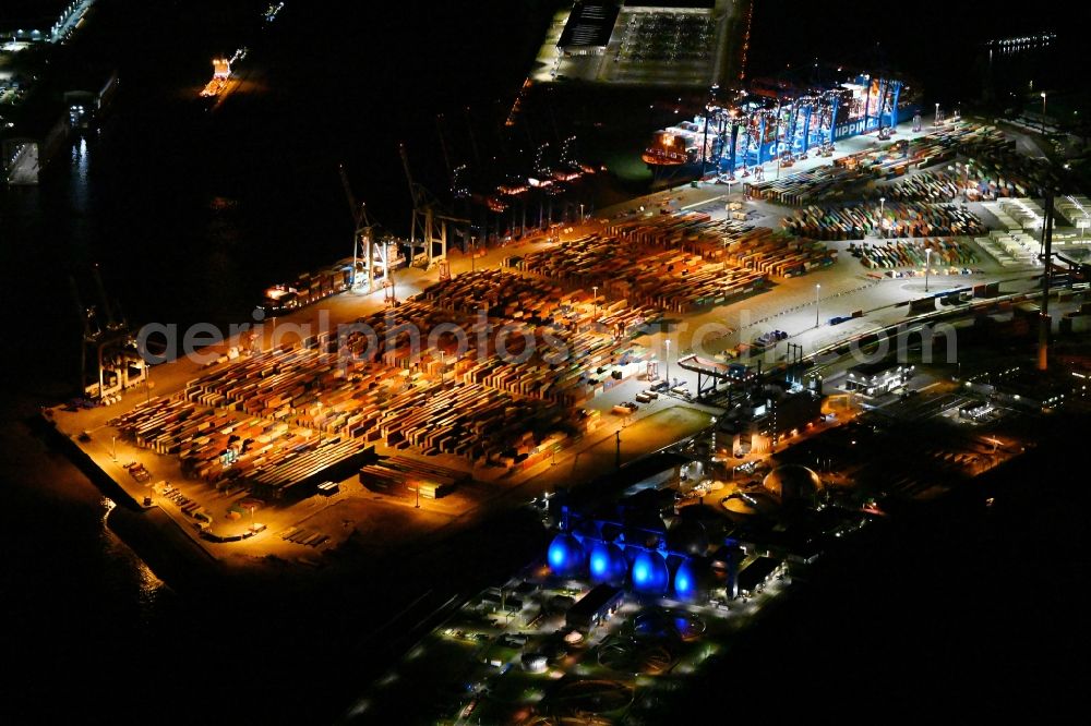 Aerial image at night Hamburg - Night lighting container Terminal Tollerort in the port of the international port in district Steinwerder in the district Steinwerder in Hamburg with sewage works Koehlbrandhoeft