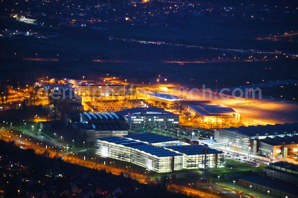 Dresden at night from the bird perspective: Night lighting Dispatch building and terminals on the premises of the airport in the district Klotzsche in Dresden in the state Saxony, Germany