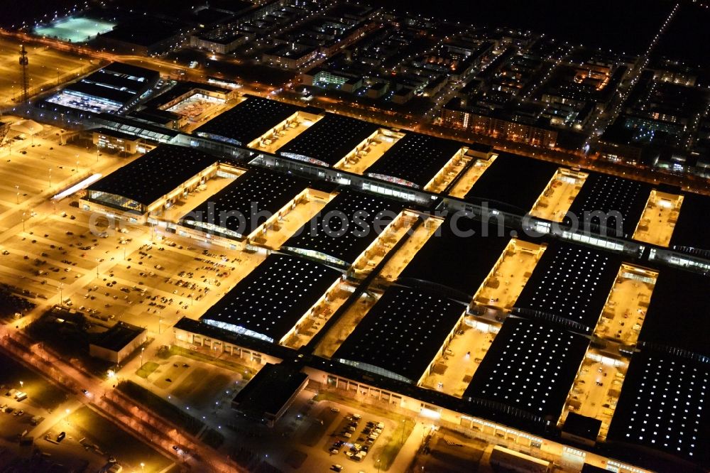 München at night from the bird perspective: Night view of the Fairgrounds Munich in the state Bavaria