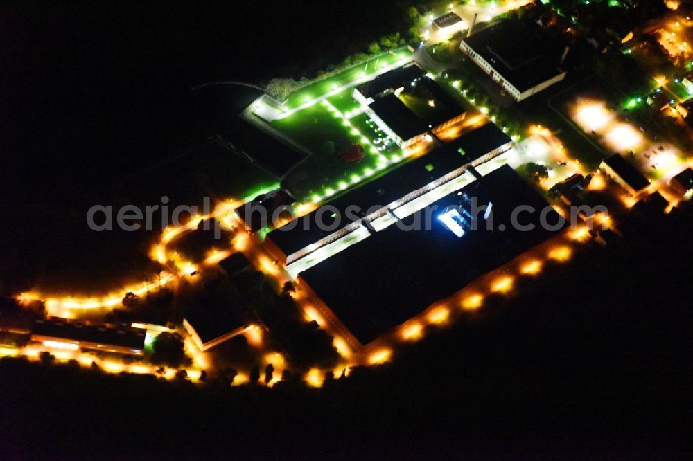Aerial photograph at night Riems - Night lighting Extension of new building site at the building complex of the institute Friedrich-Loeffler-Institutes FLI in Riems in the state Mecklenburg - Western Pomerania, Germany