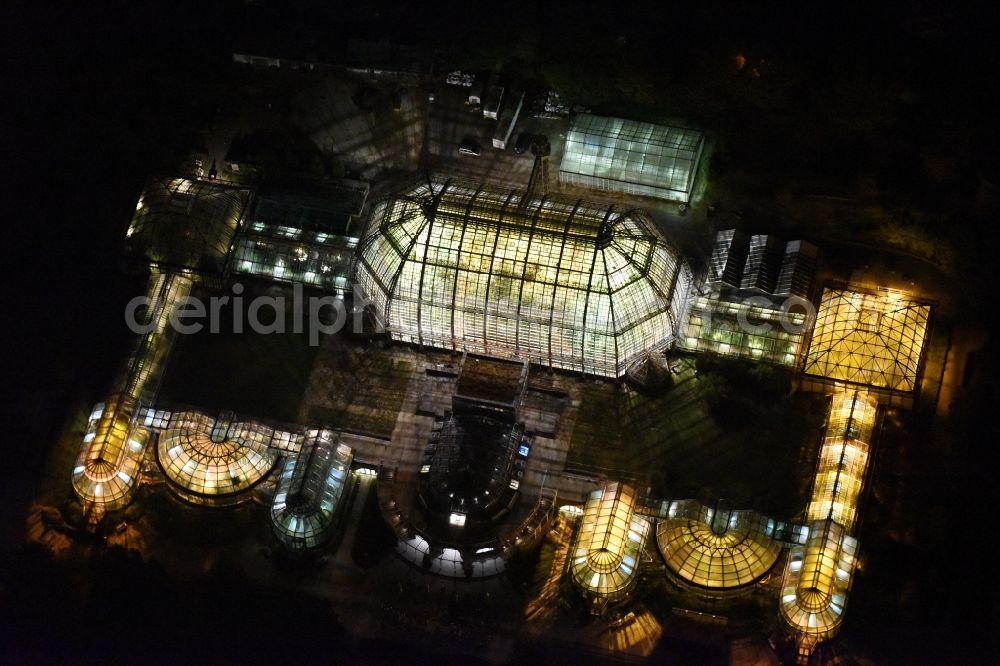 Berlin at night from above - Main building and greenhouse complex of the Botanical Gardens Berlin-Dahlem in Berlin. The historical glass buildings and greenhouses are dedicated to different areas. The Large Tropical House and the Victoria-House are located in the center