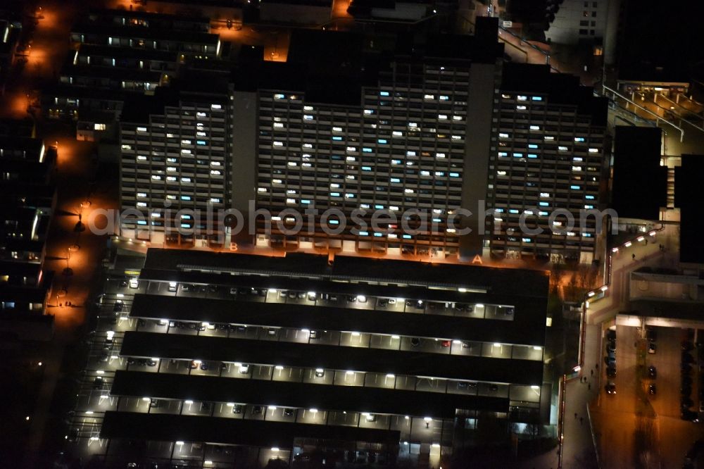 München at night from the bird perspective: Night view of the students residential complex Olympic Village highrise of the student services in Munich in the state Bavaria