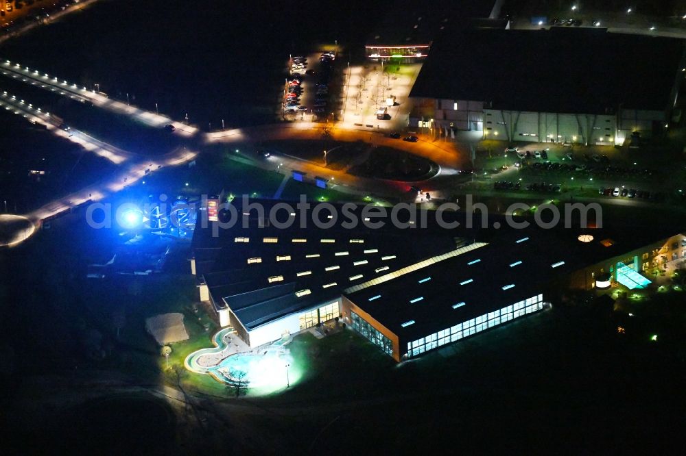 Wolfsburg at night from above - Night lighting Spa and swimming pools at the swimming pool of the leisure facility BadeLand on Allerpark in Wolfsburg in the state Lower Saxony, Germany