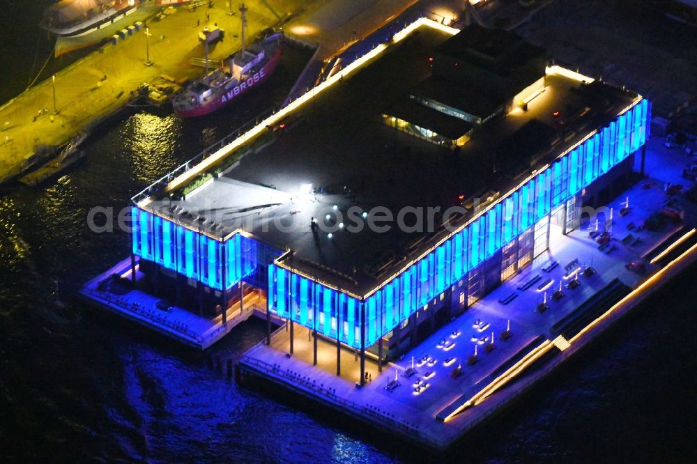 Aerial photograph at night New York - Night lighting Building of the indoor arena Pier 17 on South Street in New York in United States of America