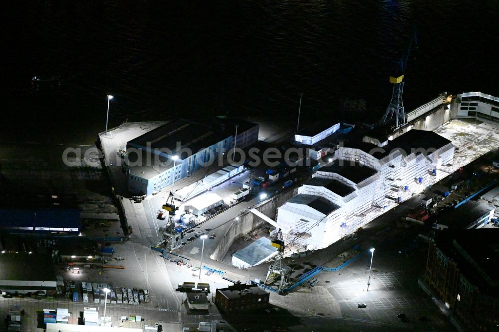 Aerial photograph at night Hamburg - Night lighting ship's hull of Yacht Dilbar in Dock Elbe 17 in dry dock on the shipyard site in the district Steinwerder in Hamburg, Germany