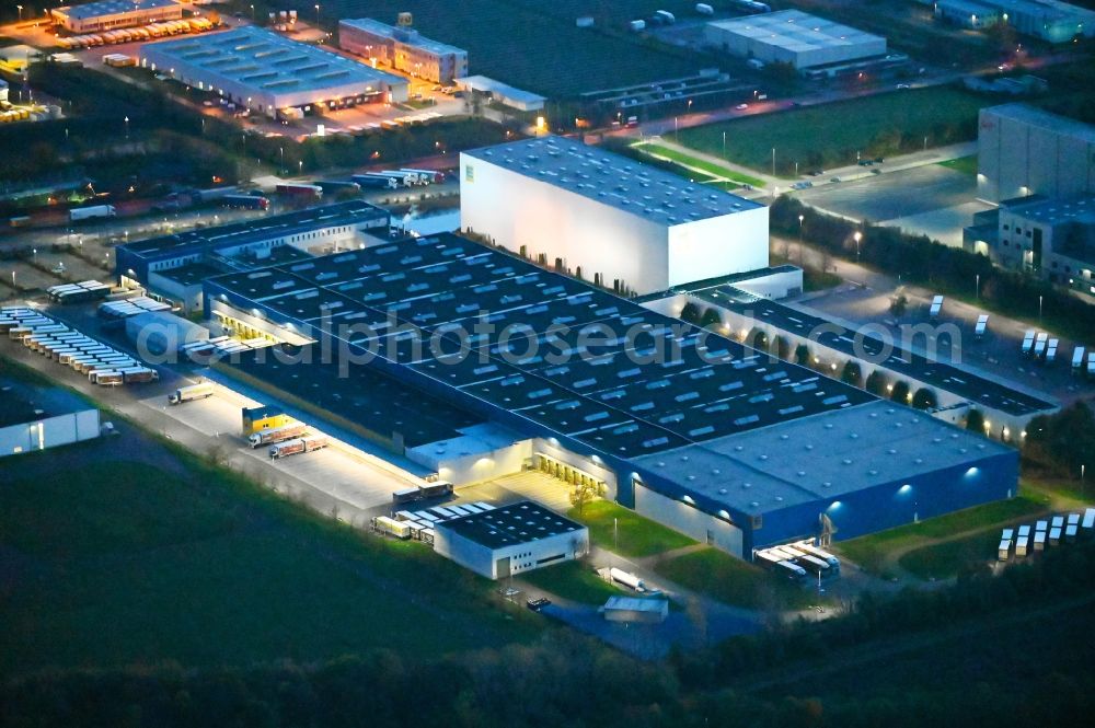 Osterweddingen at night from above - Night lighting building complex and grounds of the logistics center of EDEKA Logistikstandort in Osterweddingen in the state Saxony-Anhalt, Germany