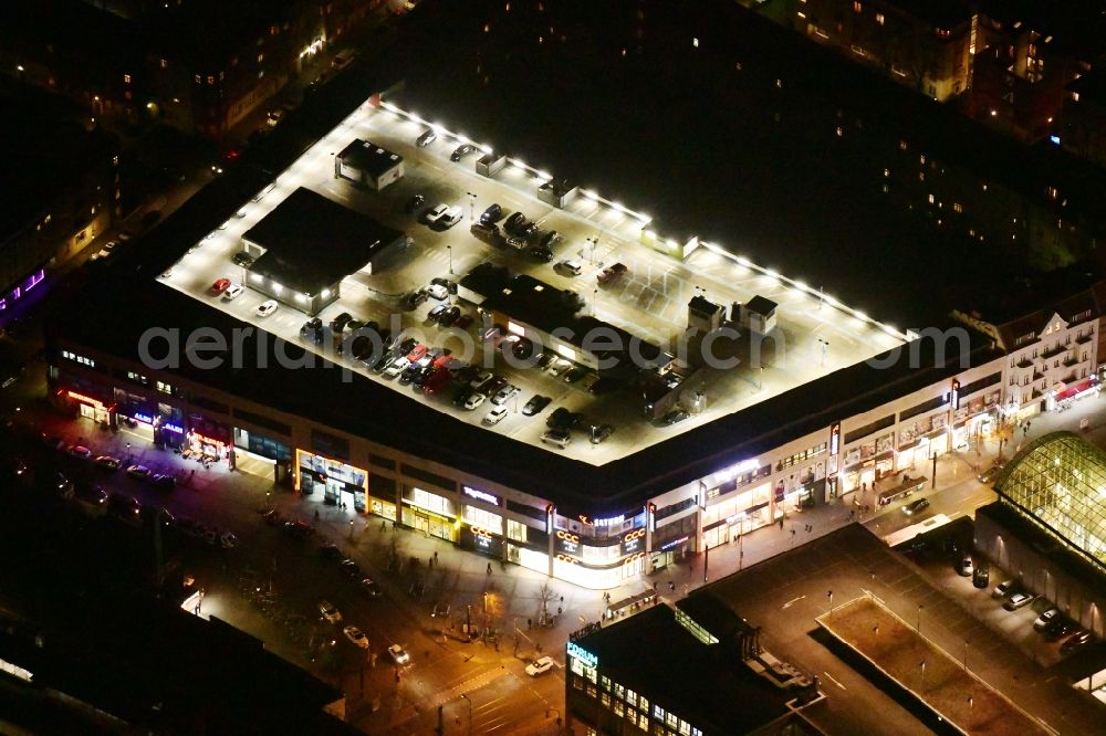Aerial photograph at night Berlin - Night lighting shopping center on Elcknerplatz at Berlin - Koepenick