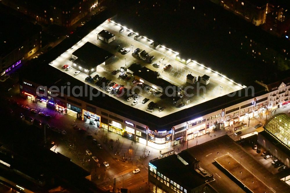 Aerial image at night Berlin - Night lighting shopping center on Elcknerplatz at Berlin - Koepenick