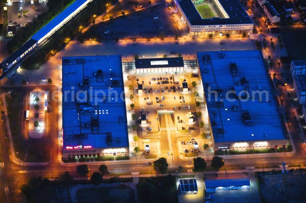 Aerial image at night Berlin - Night lighting of the shopping Mall Biesdorf Center on Weissenhoher Strasse in Berlin Biesdorf