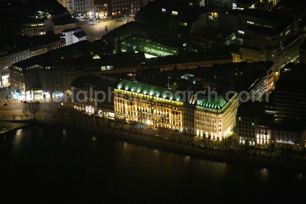 Aerial photograph at night Hamburg - Night lighting complex of the hotel building Fairmont Hotel Vier Jahreszeiten on Neuer Jungfernstieg in Hamburg, Germany