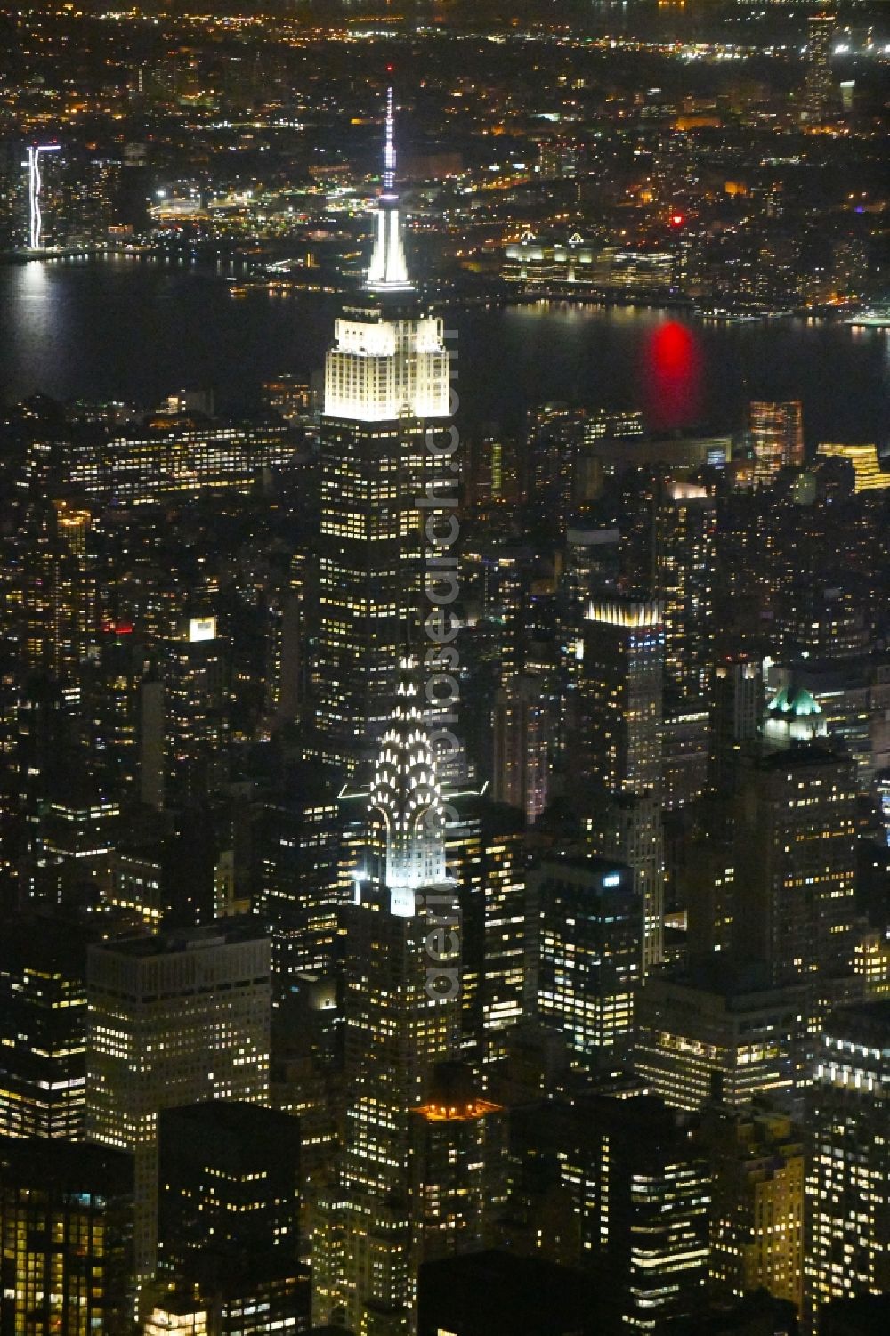 Aerial photograph at night New York - Night lighting High-rise buildings Empire State Building 5th Avenue in New York in United States of America