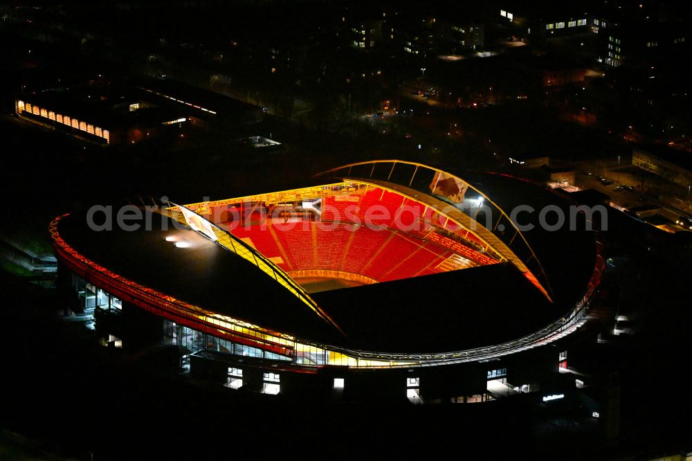 Leipzig at night from the bird perspective: Night lighting on the sports ground of the stadium Red Bull Arena Am Sportforum in Leipzig in the state Saxony, Germany