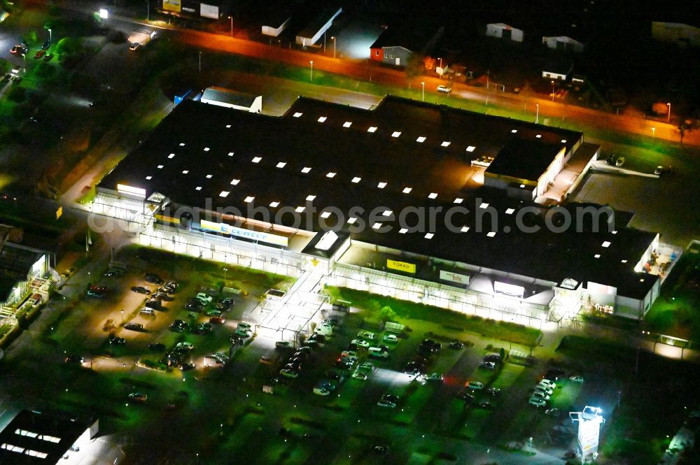 Aerial image at night Wernigerode - Night lighting building of the shopping center EDEKA on Halberstaedter Strasse in Wernigerode in the state Saxony-Anhalt, Germany