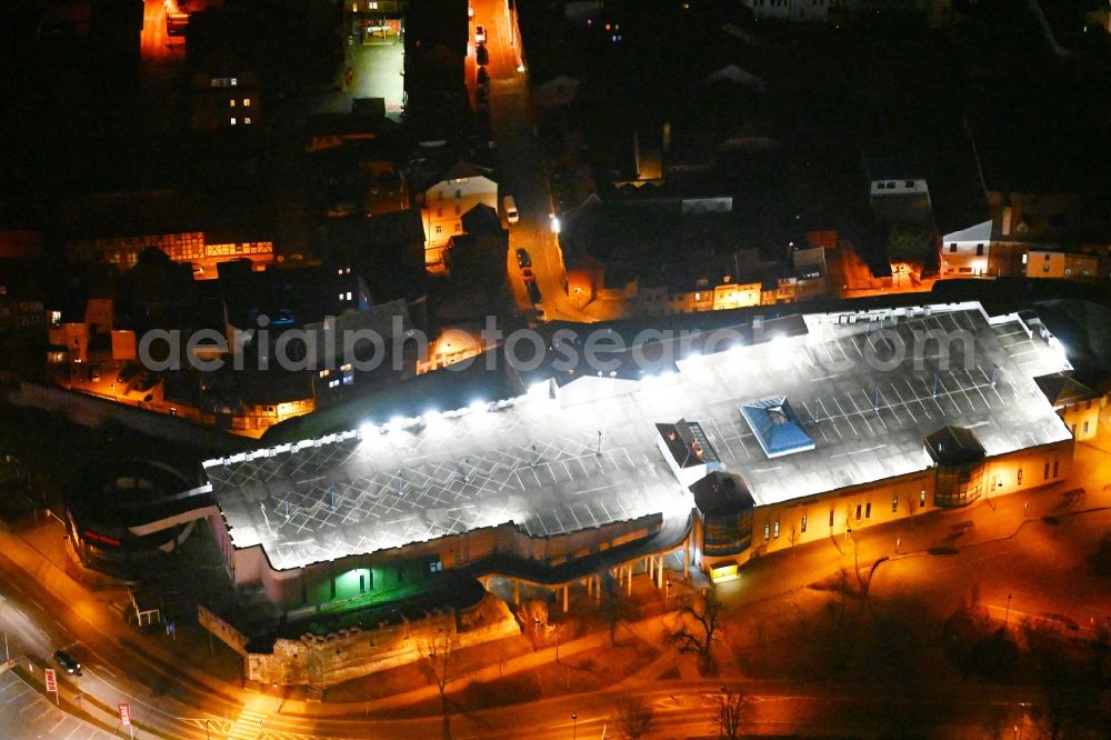 Mühlhausen at night from above - Night lighting building of the shopping center Burggalerie Muehlhausen in Muehlhausen in the state Thuringia, Germany