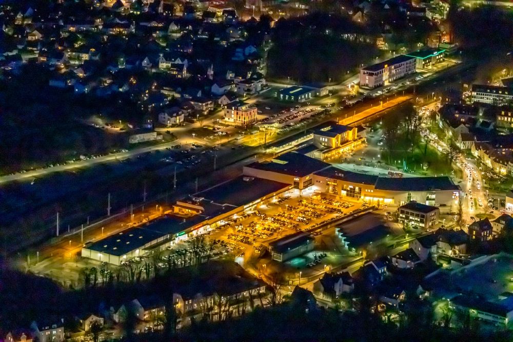 Aerial image at night Soest - Night lighting building of the shopping center City Center Soest at the train station in Soest in the state North Rhine-Westphalia, Germany