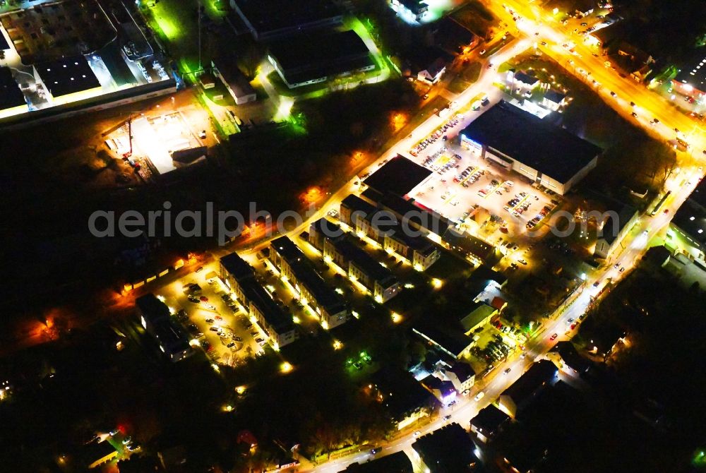Aerial photograph at night Berlin - Night lighting Building of the shopping center EDEKA Center Brehm and dm-drogerie markt in Berlin, Germany