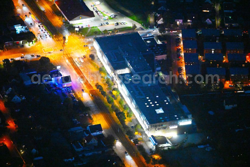 Aerial image at night Berlin - Night lighting building of the shopping center Hansa Center Berlin on Hansastrasse in the district Hohenschoenhausen in Berlin, Germany