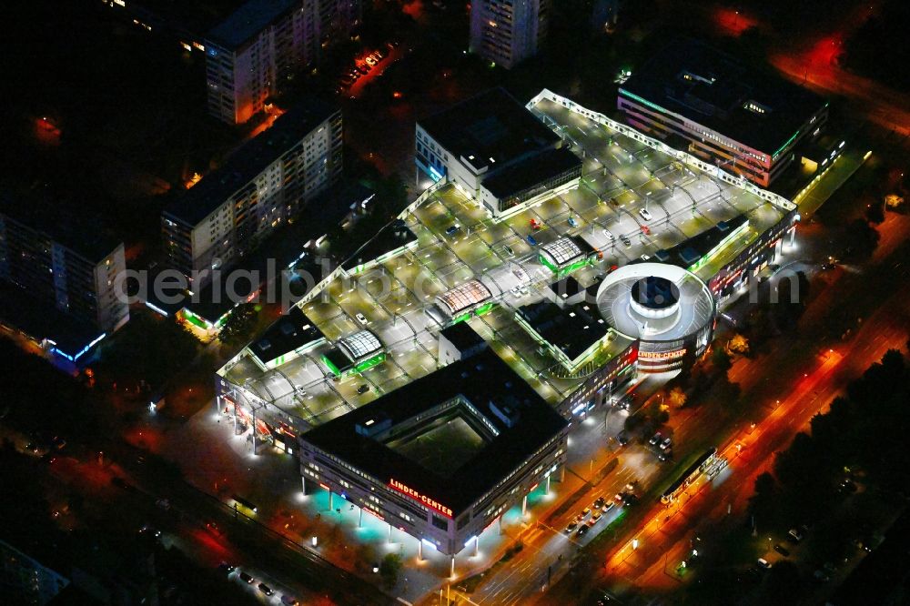 Berlin at night from the bird perspective: Night lighting building of the shopping center Linden-Center Berlin on Prerower Platz in the district Neu-Hohenschoenhausen in the district Hohenschoenhausen in Berlin, Germany