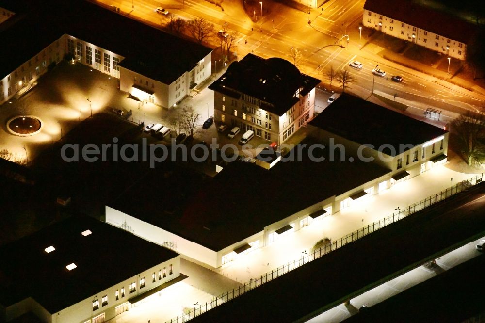 Ludwigsfelde at night from above - Night lighting Building of the shopping center Ludwig Arkaden of McCafferty Asset Management GmbH in Ludwigsfelde in the state Brandenburg, Germany