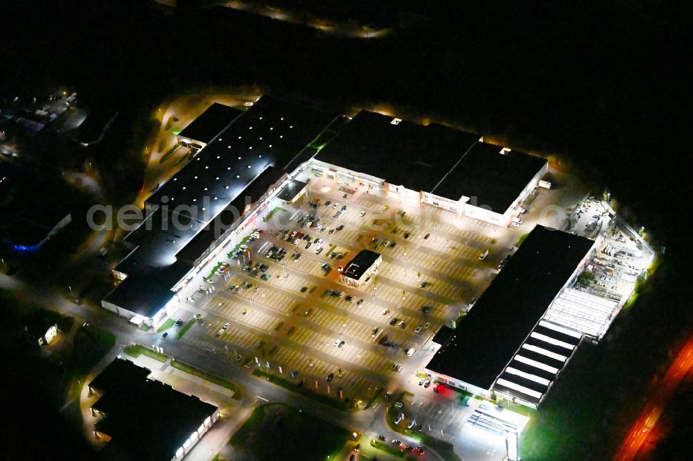 Blankenburg (Harz) at night from above - Night lighting parking space for parked cars at the shopping center Nordharz Center on Lerchenbreite in Blankenburg (Harz) in the state Saxony-Anhalt, Germany