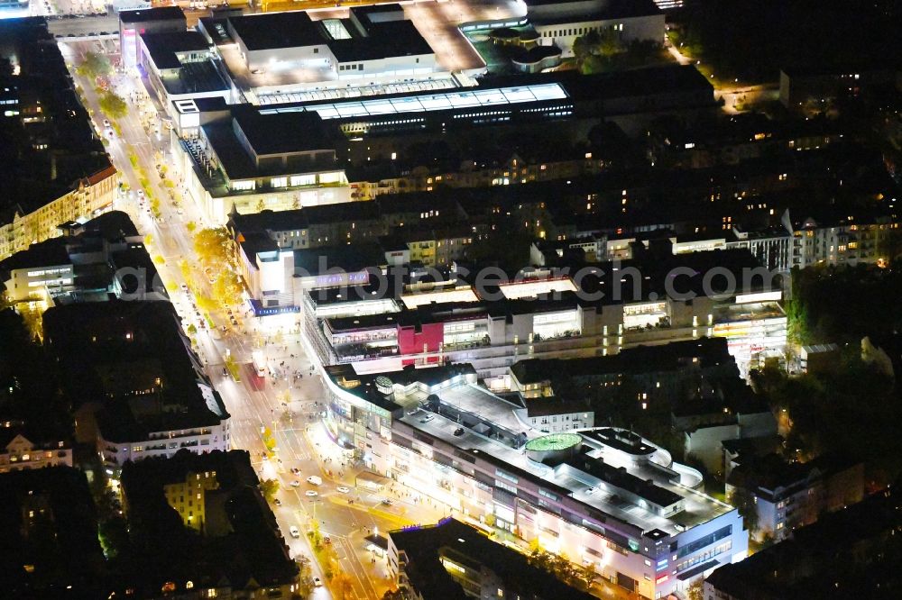 Berlin at night from the bird perspective: Night lighting building of the shopping center Schloss-Strassen-Center Berlin on place Walther-Schreiber-Platz in the district Friedenau in Berlin, Germany