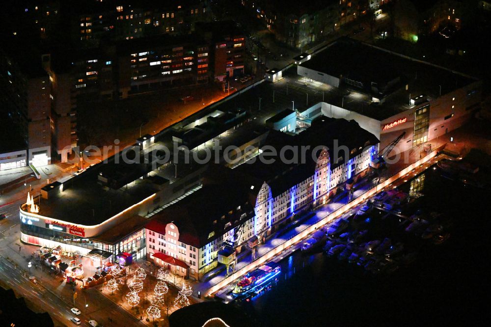 Berlin at night from the bird perspective: Night image with a view of the shopping mall Tempelhofer Hafen on Tempelhofer Damm in the district of Tempelhof in Berlin