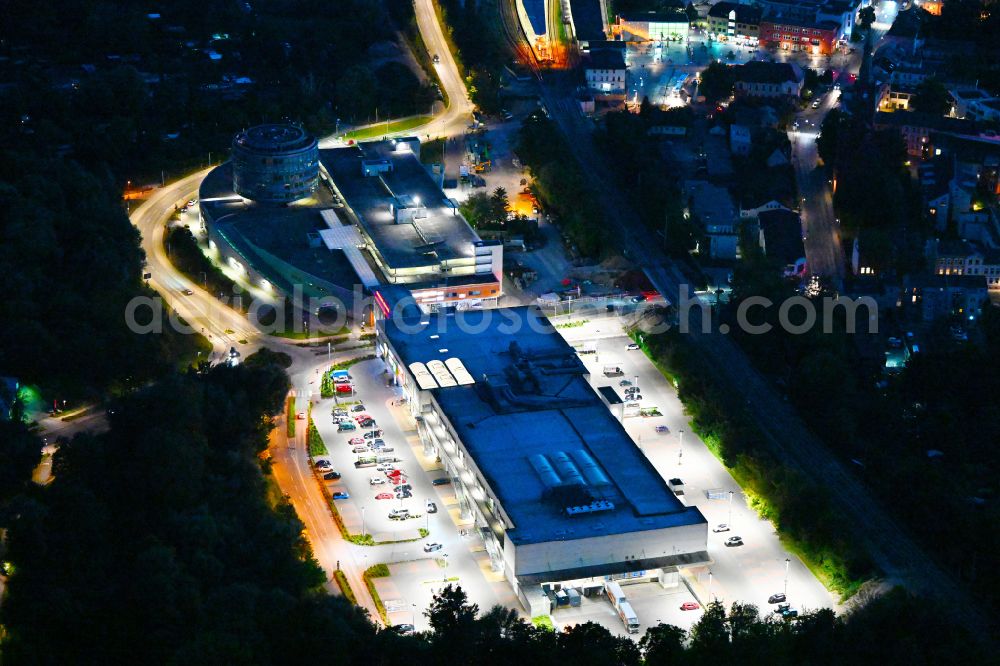 Aerial image at night Bernau - Night lighting building of the shopping center Bahnhofs-Passage Bernau in Bernau in the state Brandenburg, Germany