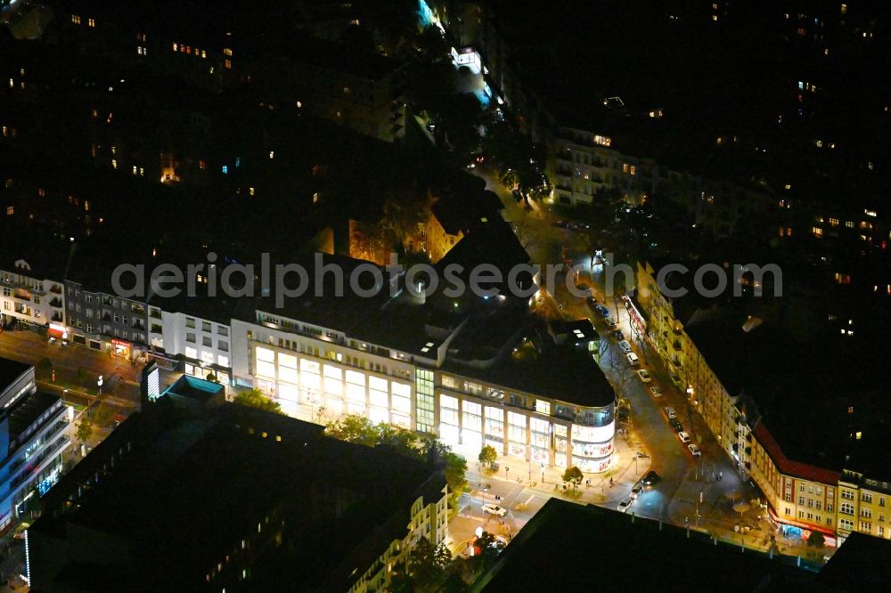 Berlin at night from the bird perspective: Night lighting building of the shopping center Peek & Cloppenburg on Schlossstrasse corner Feuerbachstrasse in the district Steglitz in Berlin, Germany