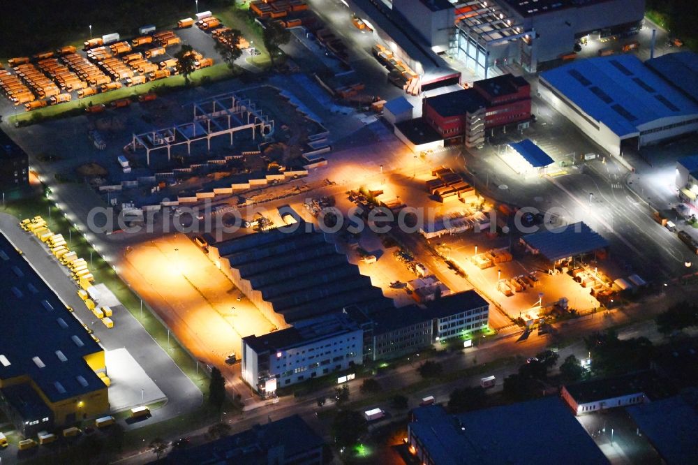 Berlin at night from above - Night lighting construction site on building and production halls on the premises of Berliner Stadtreinigungsbetriebe on Gradestrasse in the district Britz in Berlin, Germany