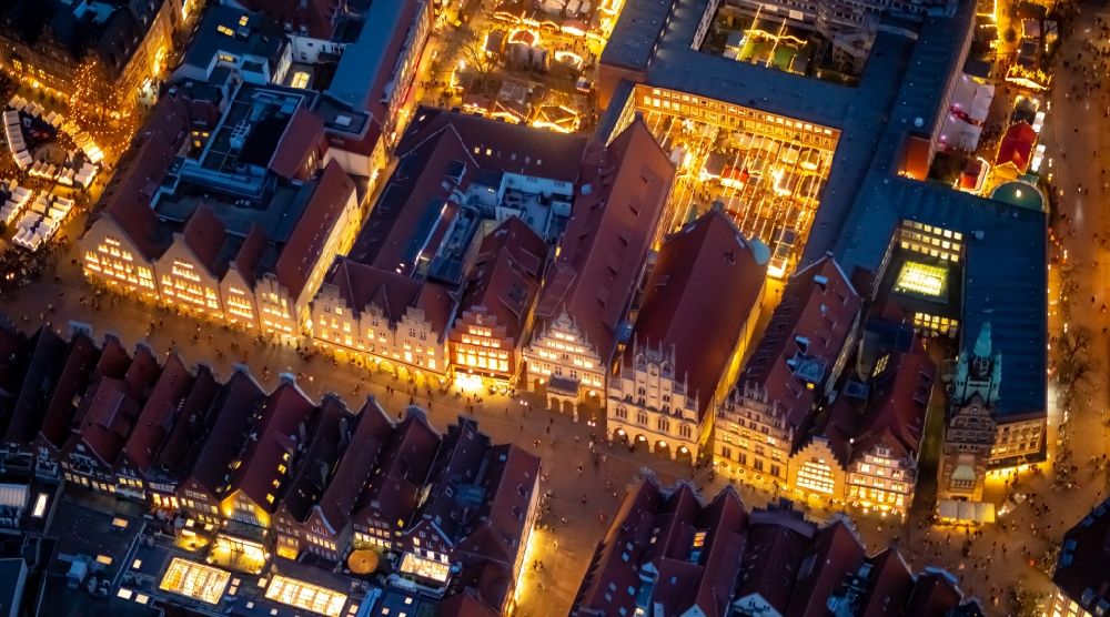 Aerial image at night Münster - Night lighting half-timbered house and multi-family house- residential area in the old town area and inner city center in Muenster in the state North Rhine-Westphalia, Germany