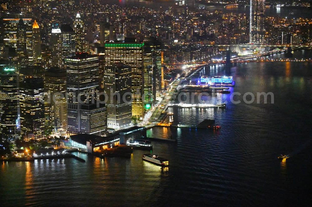 New York at night from above - Night lighting Ride a ferry ship Staten Island Ferry on Hochhaus - Skyline on FDR Drive in the district Manhattan in New York in United States of America