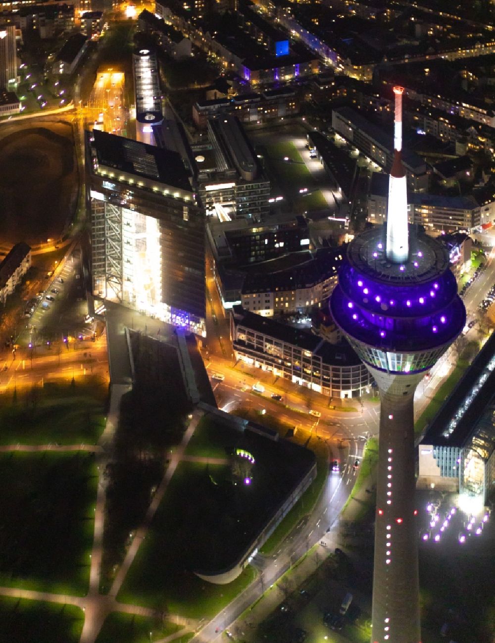 Düsseldorf at night from above - Night lighting top of the Television Tower Rheinturm with the city center in the background in Duesseldorf in the state North Rhine-Westphalia