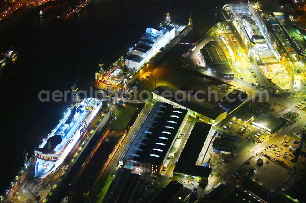 Aerial image at night Hamburg - Night lighting ferry ship SPIRIT OF FRANCE on Shipyard on the elbe banks in Hamburg, Germany