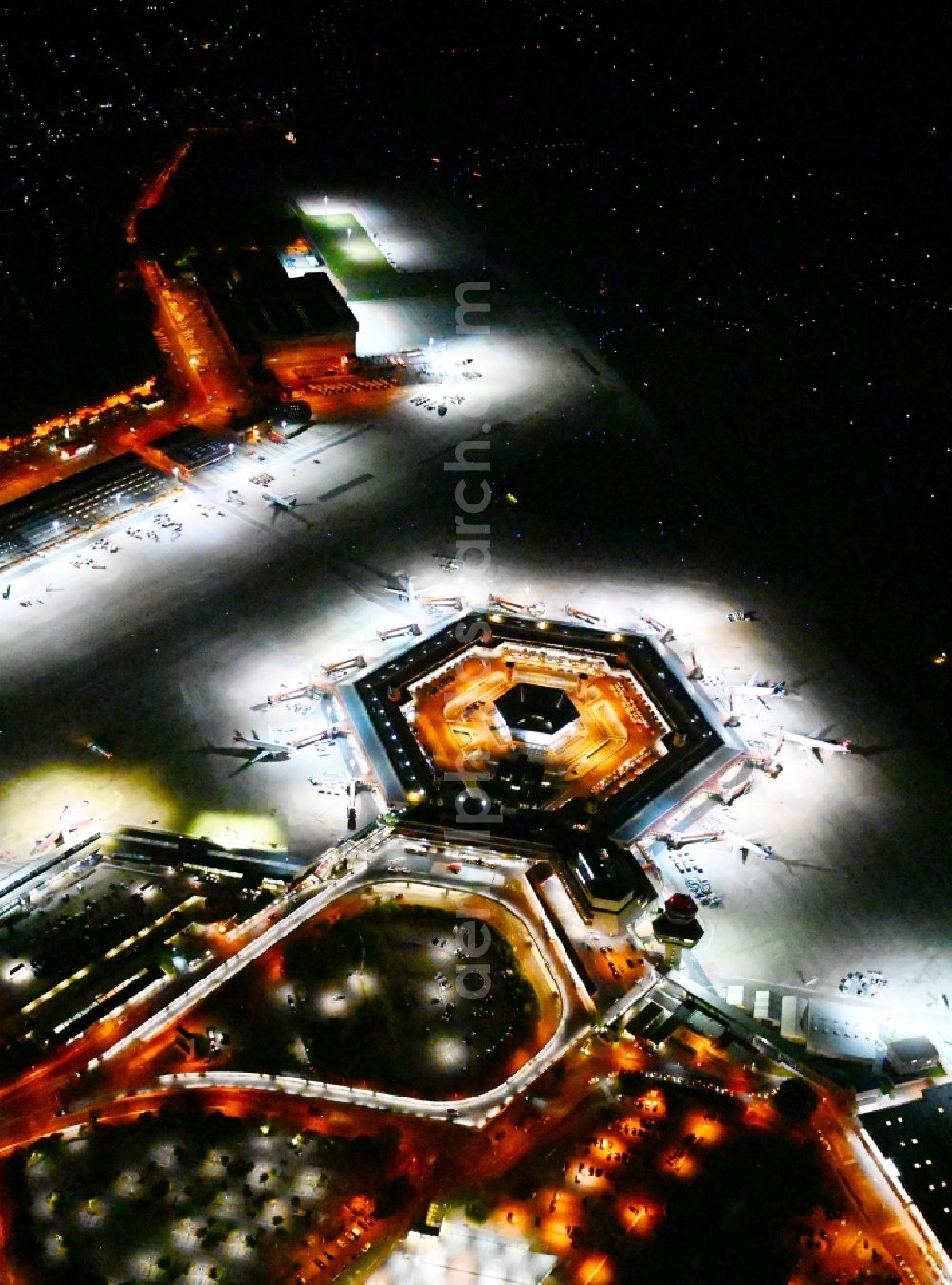 Aerial photograph at night Berlin - Night lighting flight operations at the terminal of the airport Berlin - Tegel