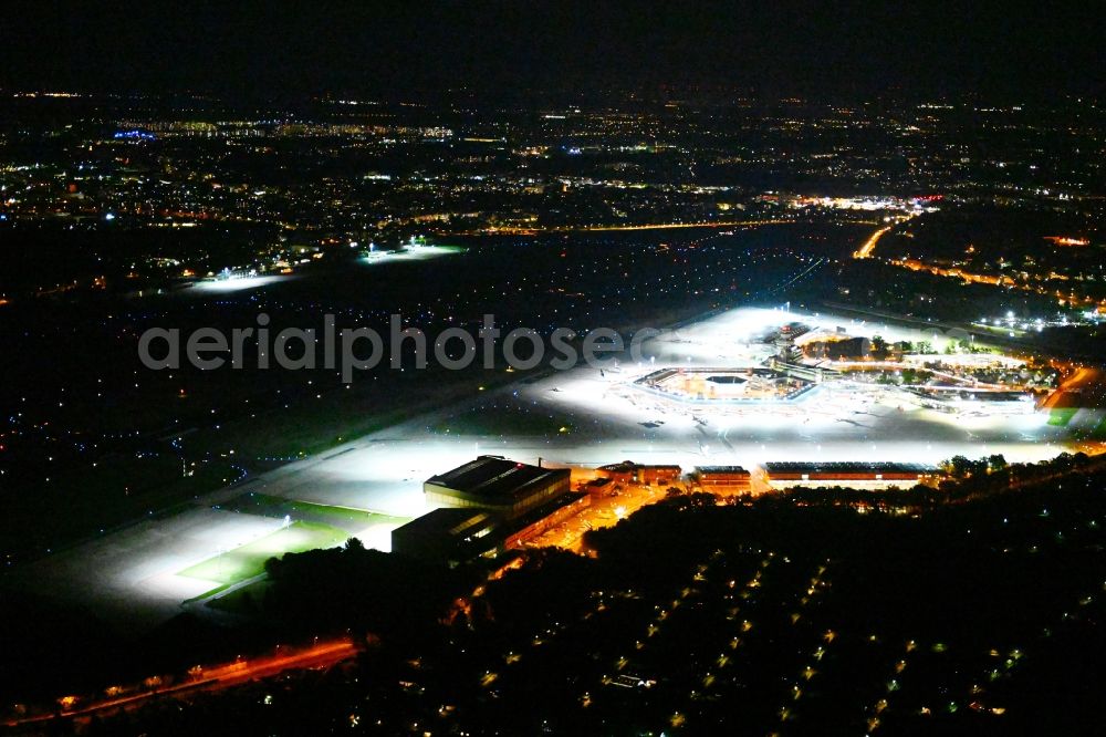 Aerial image at night Berlin - Night lighting flight operations at the terminal of the airport Berlin - Tegel