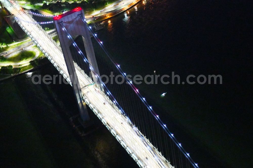 Aerial photograph at night New York - Night lighting River - bridge construction Verrazano-Narrows Bridge Staten Island in New York in United States of America