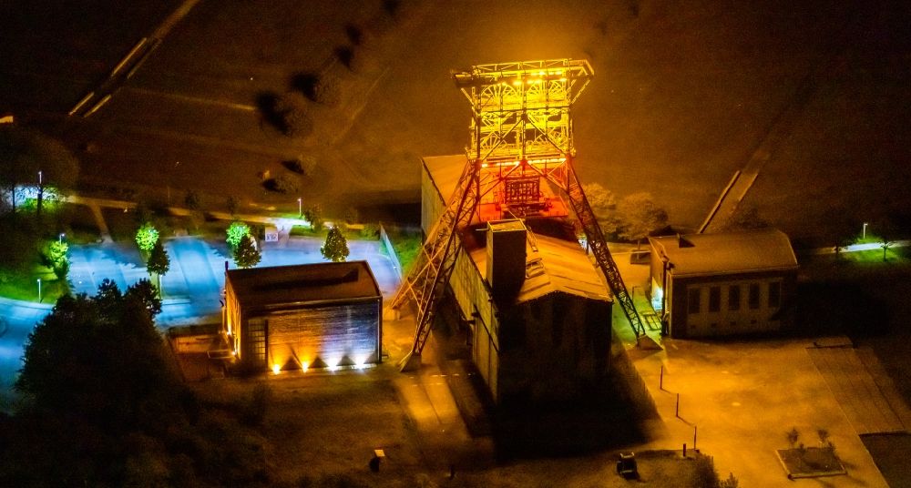 Aerial image at night Gelsenkirchen - Night lighting conveyors and mining pits at the headframe Zeche Consolidation 3 on Consolstrasse in Gelsenkirchen at Ruhrgebiet in the state North Rhine-Westphalia, Germany