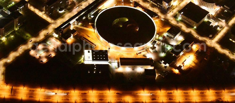 Aerial photograph at night Berlin - Night lighting research building and office complex Elektronen- Speicherring BESSY - Synchrotronstrahlungsquelle in the district Adlershof in Berlin, Germany