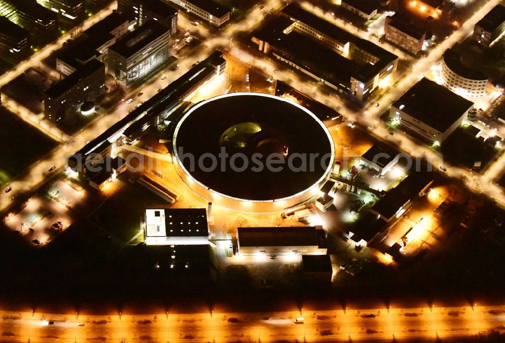 Aerial image at night Berlin - Night lighting research building and office complex Elektronen- Speicherring BESSY - Synchrotronstrahlungsquelle in the district Adlershof in Berlin, Germany