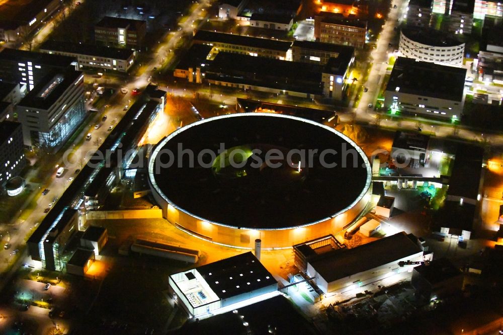 Berlin at night from the bird perspective: Night lighting research building and office complex Elektronen- Speicherring BESSY - Synchrotronstrahlungsquelle in the district Adlershof in Berlin, Germany
