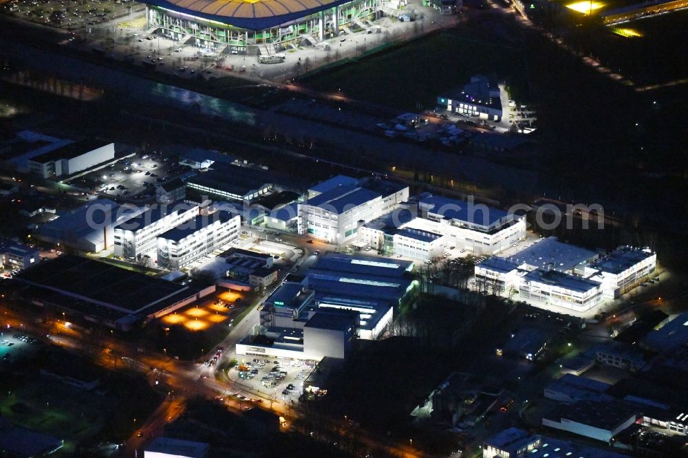 Aerial photograph at night Wolfsburg - Night lighting Research building and office complex VOLKE Entwicklungsring SE on Daimlerstrasse in the district Hesslingen in Wolfsburg in the state Lower Saxony, Germany