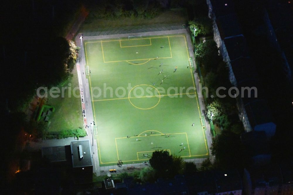 Berlin at night from above - Night lighting sports grounds and football pitch Sportplatz Hauffstrasse in the district Rummelsburg in Berlin, Germany