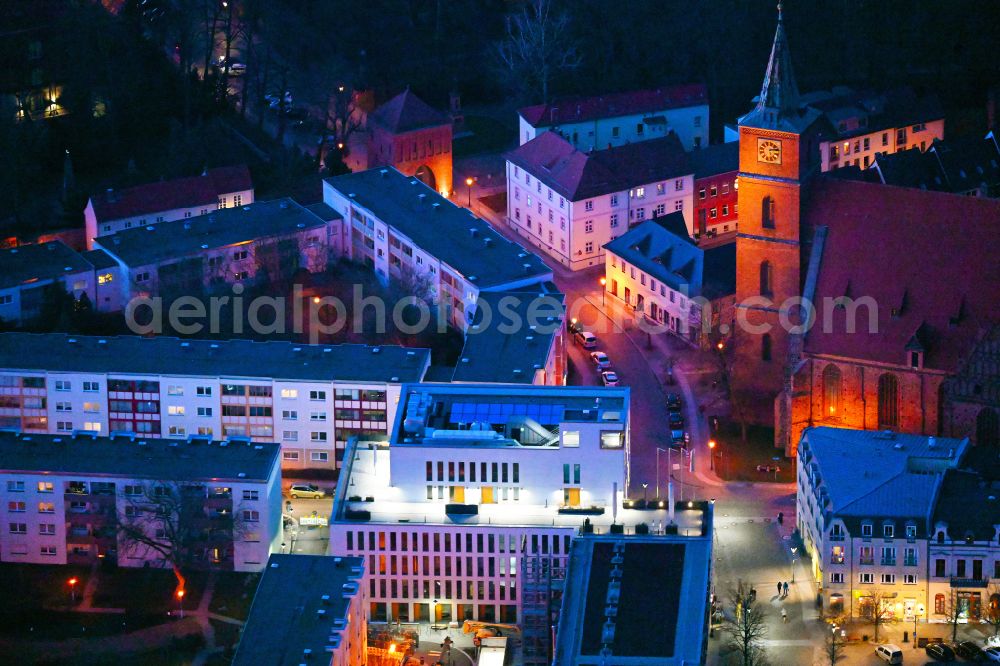 Aerial image at night Bernau - Night lighting town Hall building of the city administration Gruenstrasse corner Buergermeisterstrasse in Bernau in the state Brandenburg, Germany