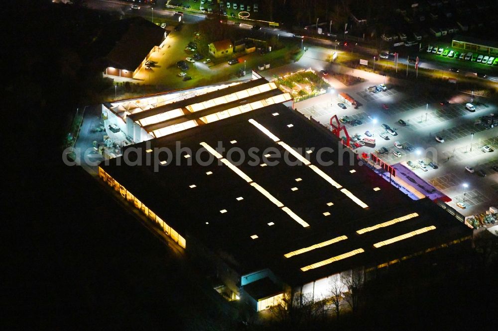 Borgsdorf at night from above - Night lighting Building of the construction market BAUHAUS Birkenwerder on Hauptstrasse in Borgsdorf in the state Brandenburg, Germany