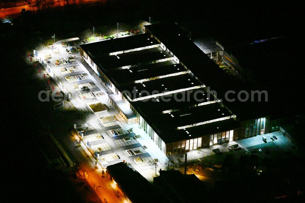 München at night from above - Night lighting building of the construction market of BAUHAUS Muenchen-Freimann on Maria-Probst-Strasse in the district Schwabing-Freimann in Munich in the state Bavaria, Germany