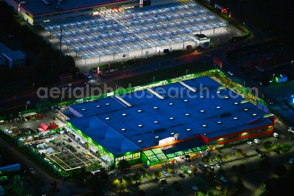 Aerial photograph at night Lindenberg - Night lighting building of the construction market of Globus Lindenberg in Lindenberg in the state Brandenburg
