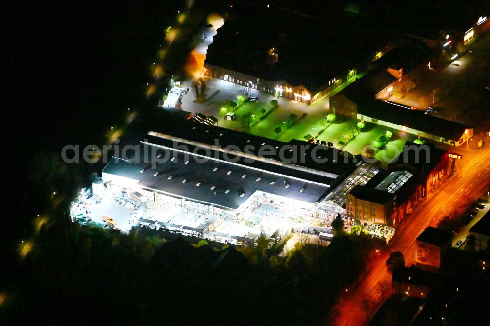 Lutherstadt Wittenberg at night from above - Night lighting Building of the construction market of OBI in Lutherstadt Wittenberg in the state Saxony-Anhalt