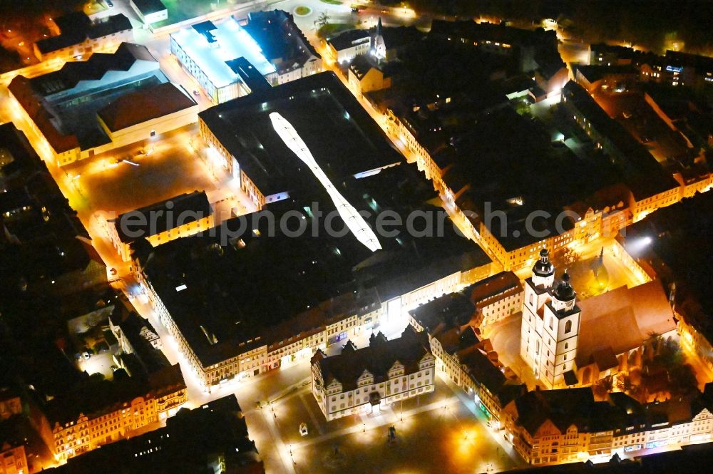 Aerial photograph at night Lutherstadt Wittenberg - Night lighting Building of the shopping center ARSENAL in Lutherstadt Wittenberg in the state Saxony-Anhalt